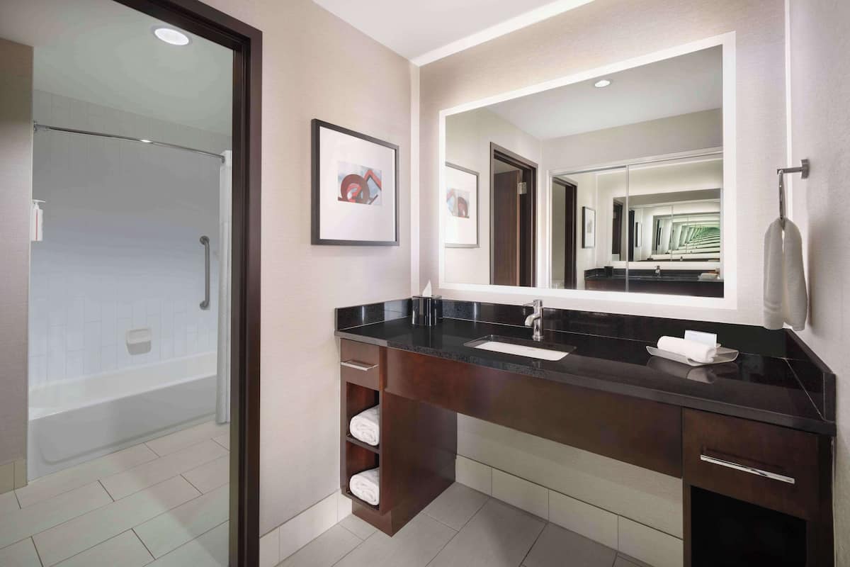 combined shower/bathtub, hair dryer, bathrobes, towels