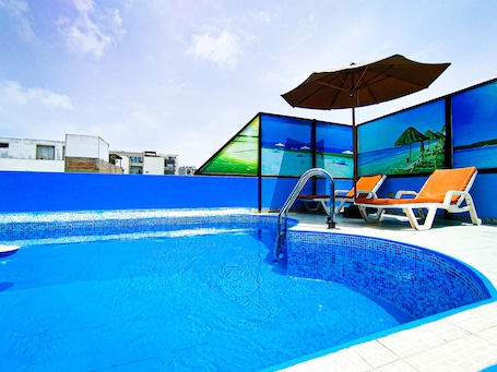 Seasonal outdoor pool, open 10:00 AM to 8:00 PM, sun loungers