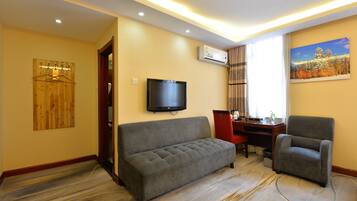 Family Room | Premium bedding, down duvets, in-room safe, desk