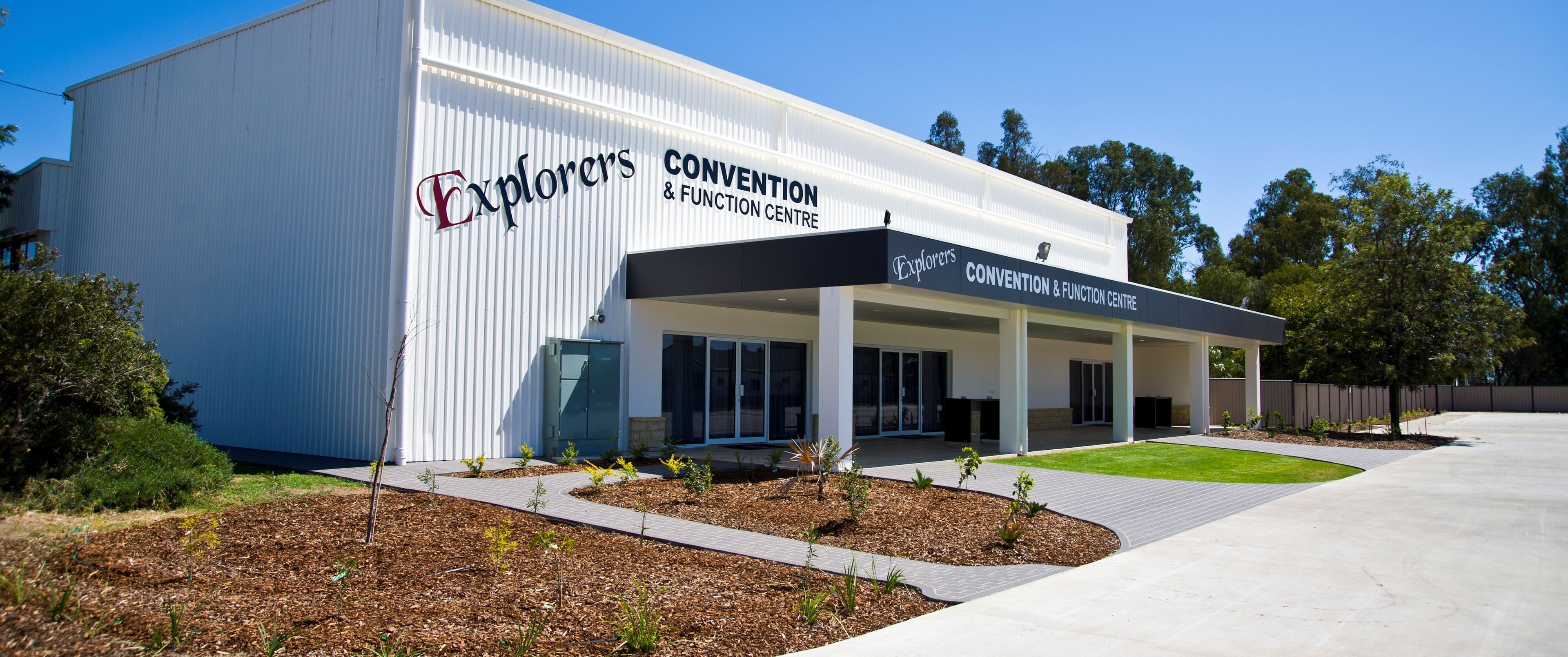 A modern building with the sign "Explorers Convention & Function Centre".