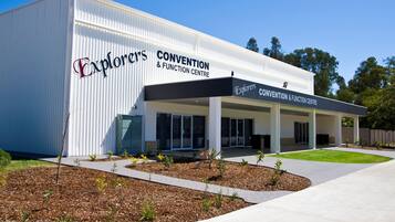 A modern building with the sign "Explorers Convention & Function Centre".