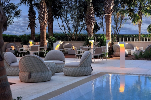 Outdoor pool, open 10:00 AM to 6:00 PM, cabanas (surcharge)