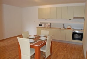 Fridge, microwave, stovetop, cookware/dishes/utensils