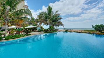 2 outdoor pools, open 7 AM to 7 PM, pool umbrellas, pool loungers