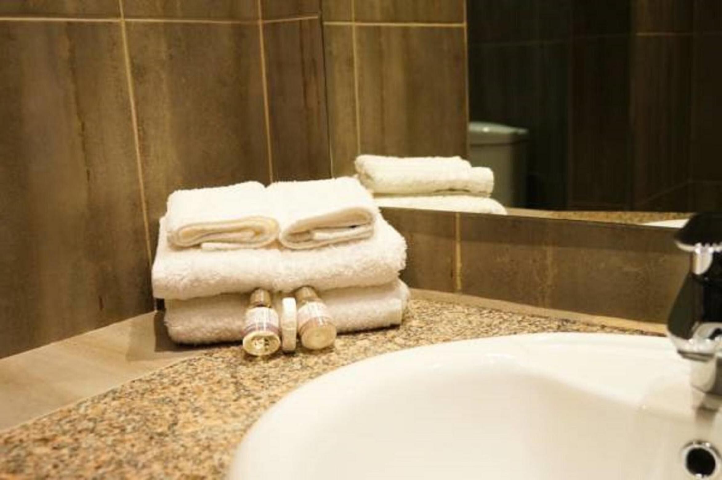 hydromassage showerhead, designer toiletries, hair dryer, towels