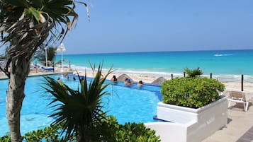 Private beach, white sand, sun loungers, beach umbrellas