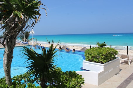 Private beach, white sand, sun loungers, beach umbrellas