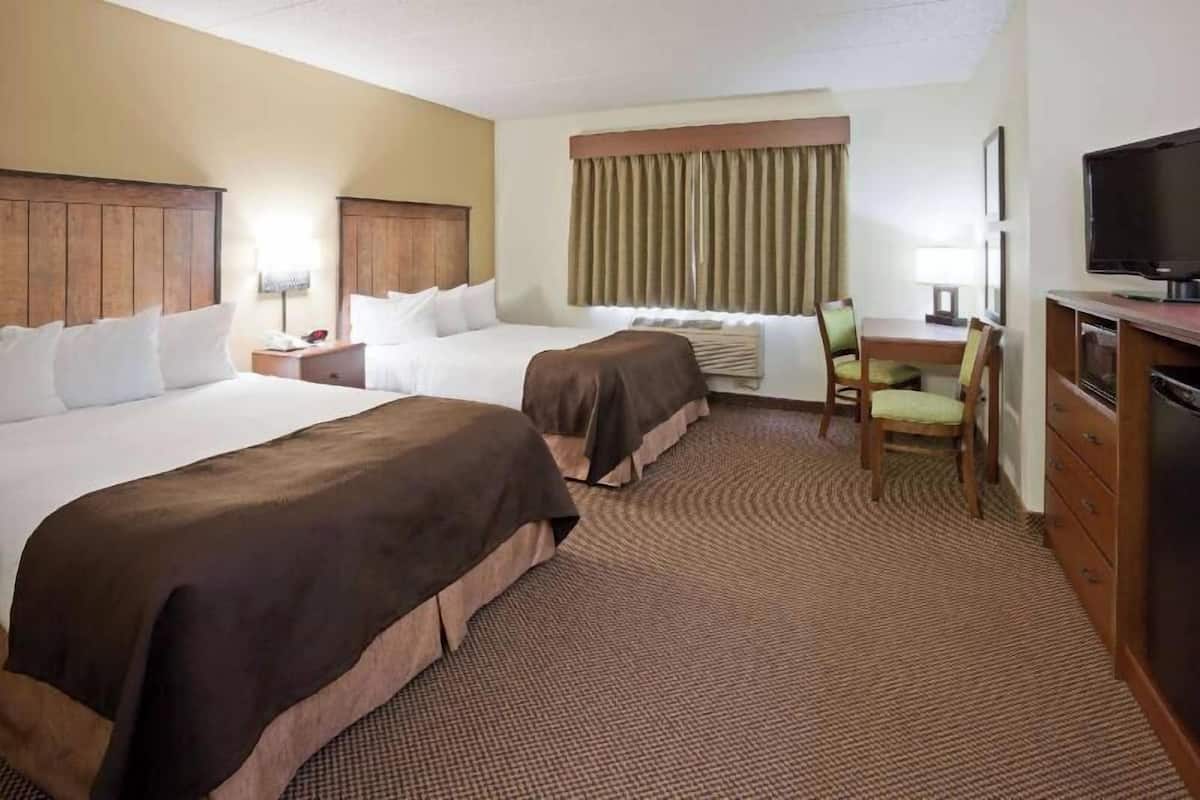 Premium bedding, desk, blackout drapes, iron/ironing board
