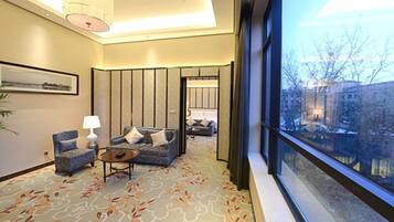 Business Suite, Garden View | Living area | 42-inch LCD TV with satellite channels, TV, pay films