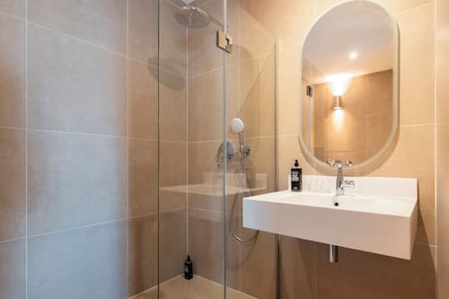 Shower, eco-friendly toiletries, hair dryer, towels