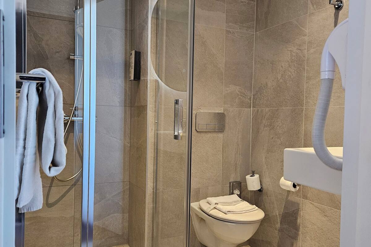 shower, eco-friendly toiletries, hair dryer, towels