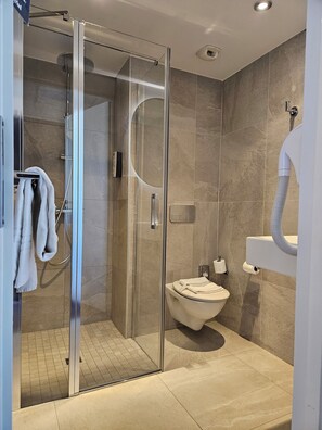 Shower, eco-friendly toiletries, hair dryer, towels