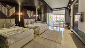 A modern hotel room with two beds, a TV, and a view of the pool.