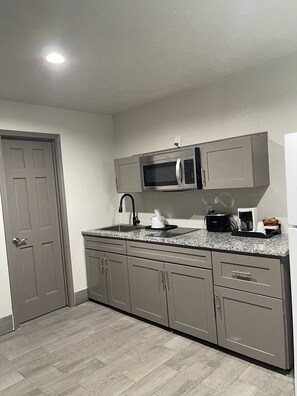Suite, Non Smoking (2 King Beds) | Private kitchen | Fridge, microwave