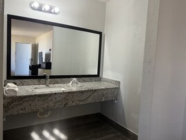 Room, 1 King Bed | Bathroom | Combined shower/tub, deep soaking tub, rainfall showerhead, towels