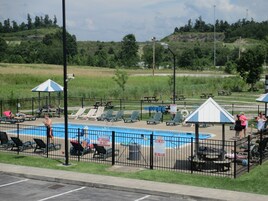 Seasonal outdoor pool, open 9 AM to 10 PM, pool umbrellas, sun loungers