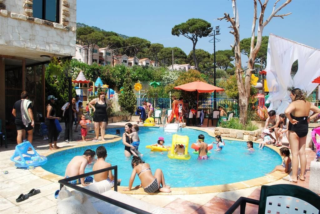 Indoor pool, outdoor pool, pool umbrellas, pool loungers