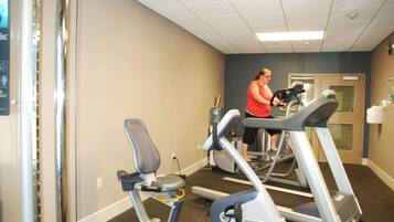A gym with treadmills and exercise equipment.