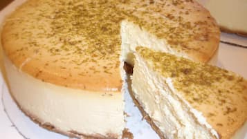 A cheesecake with a slice cut out.
