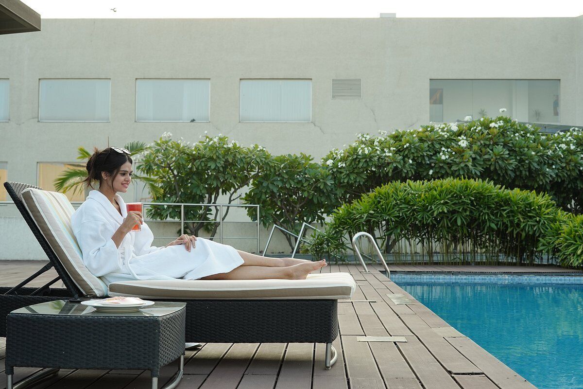 outdoor pool, open 8:00 am to 8:00 pm, pool umbrellas, pool loungers