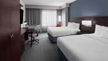 Pillowtop beds, desk, blackout drapes, iron/ironing board