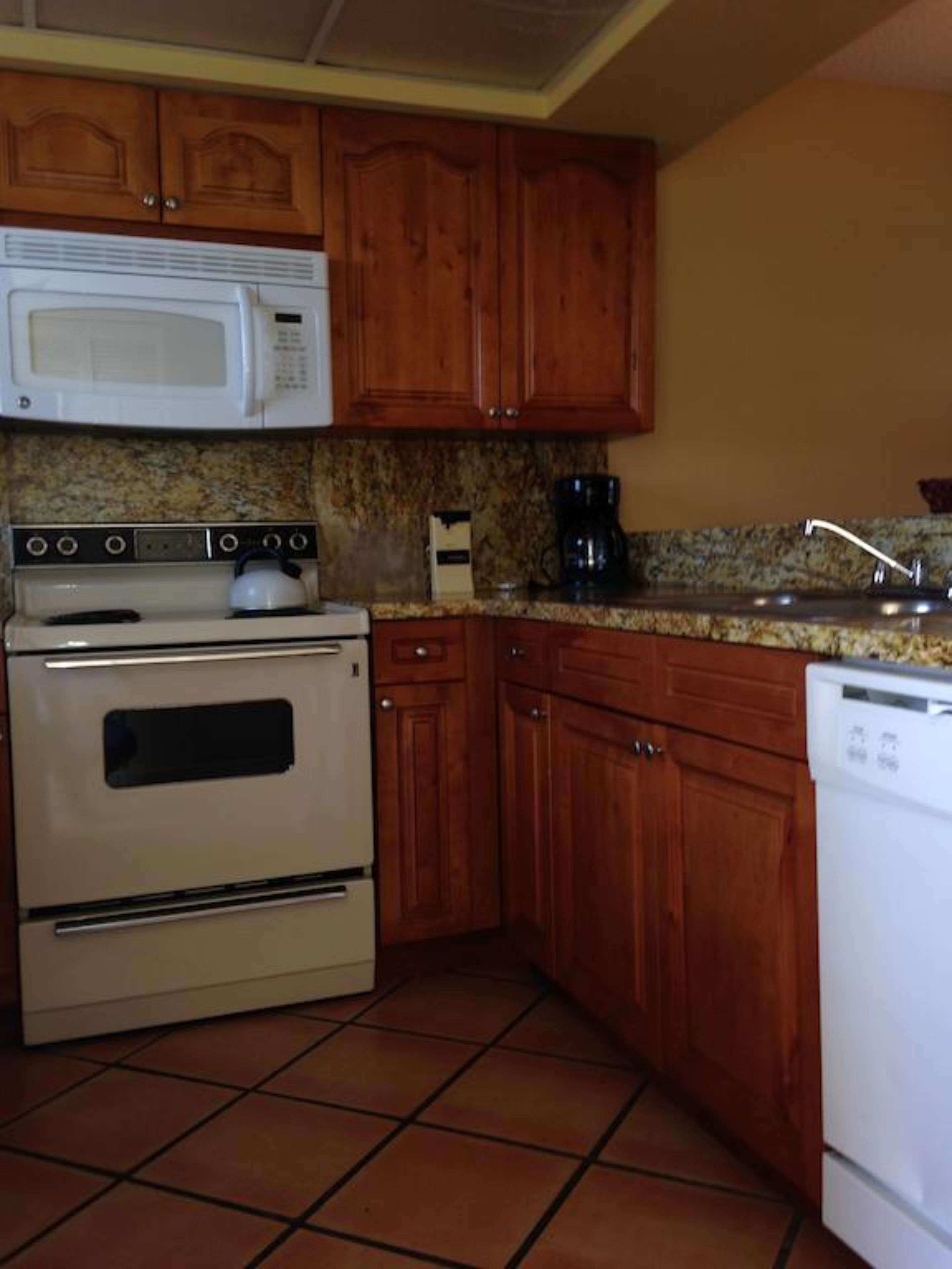 full-sized fridge, microwave, stovetop, dishwasher