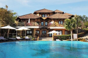 Outdoor pool, pool umbrellas, sun loungers