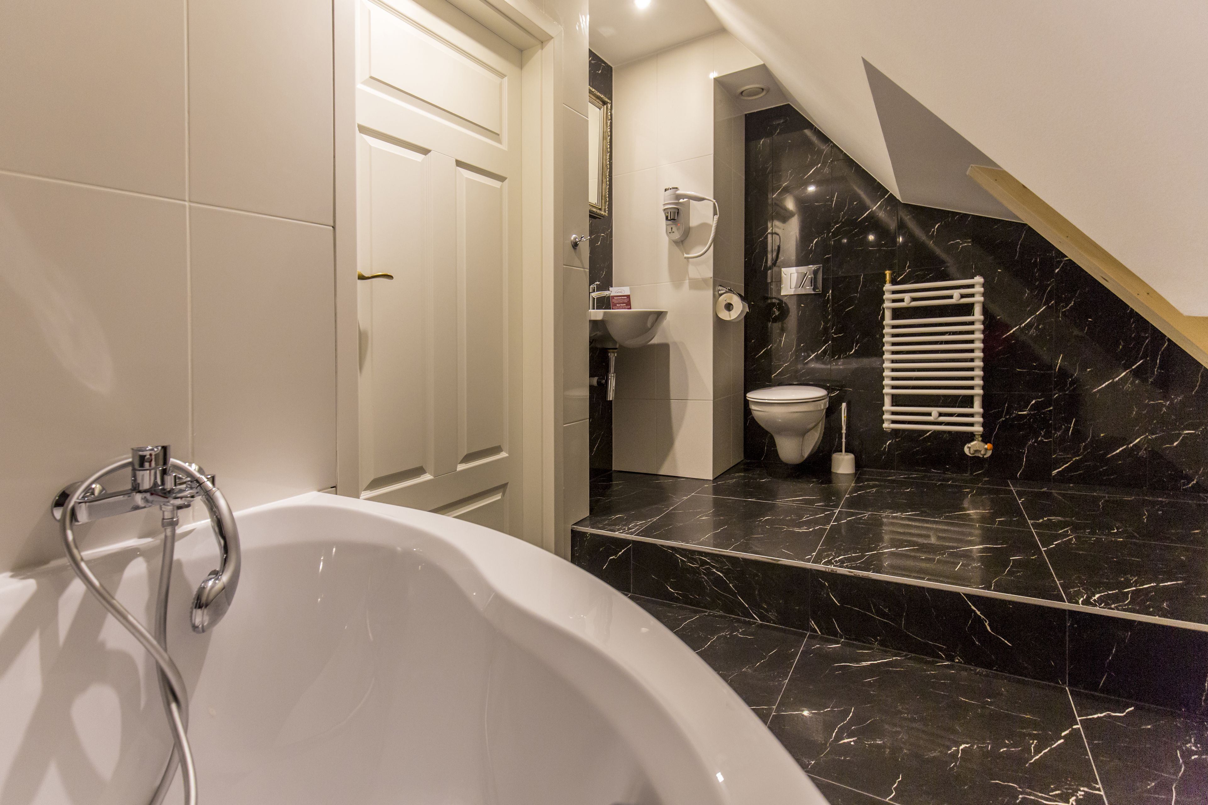 apartment | bathroom | hair dryer, towels