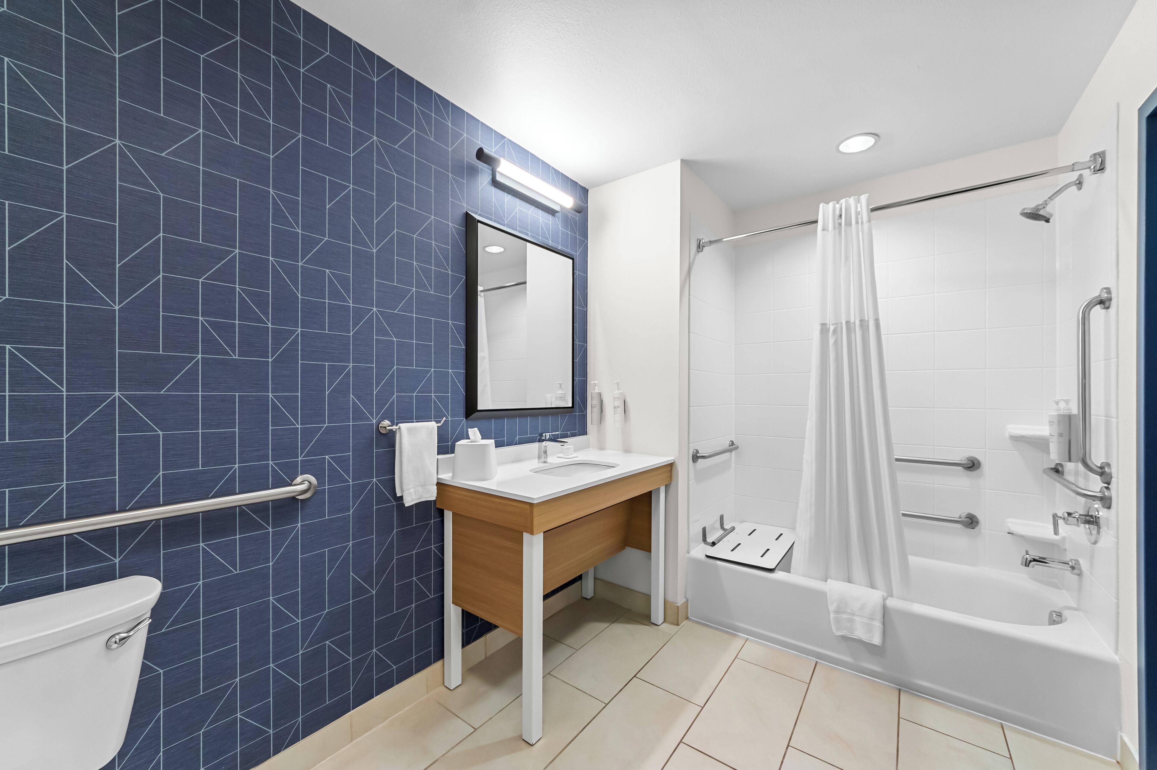 combined shower/bathtub, free toiletries, hair dryer, towels