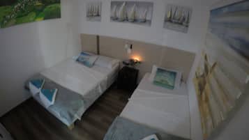 Family Triple Room, 1 Bedroom, Non Smoking | 6 bedrooms, minibar, in-room safe, blackout curtains