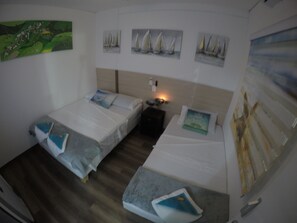 Family Triple Room, 1 Bedroom, Non Smoking | 6 bedrooms, minibar, in-room safe, blackout drapes