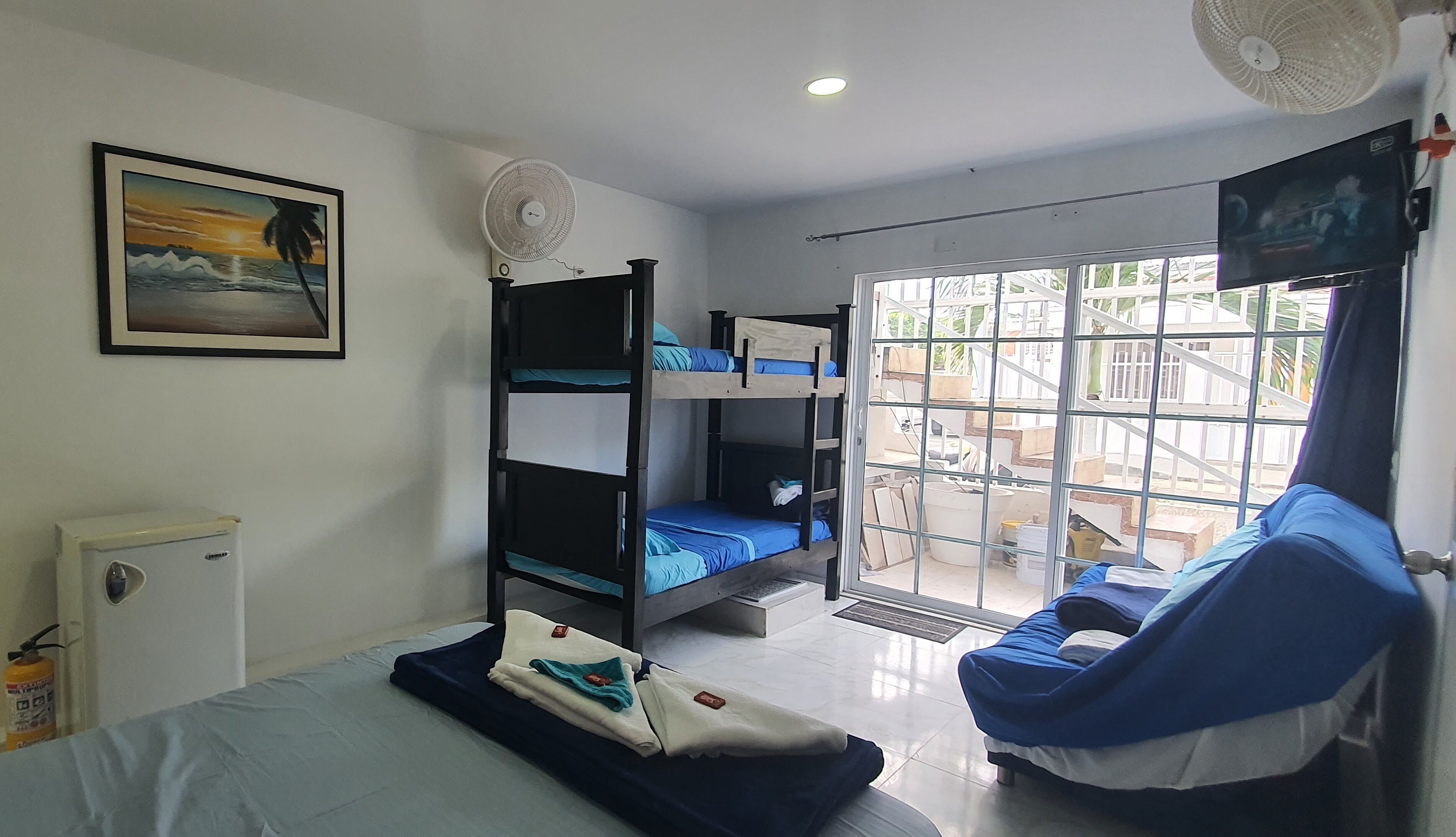 family room | 1 bedroom, minibar, in-room safe, blackout curtains