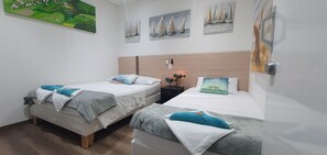 Family Triple Room, 1 Bedroom, Non Smoking | 6 bedrooms, minibar, in-room safe, blackout curtains