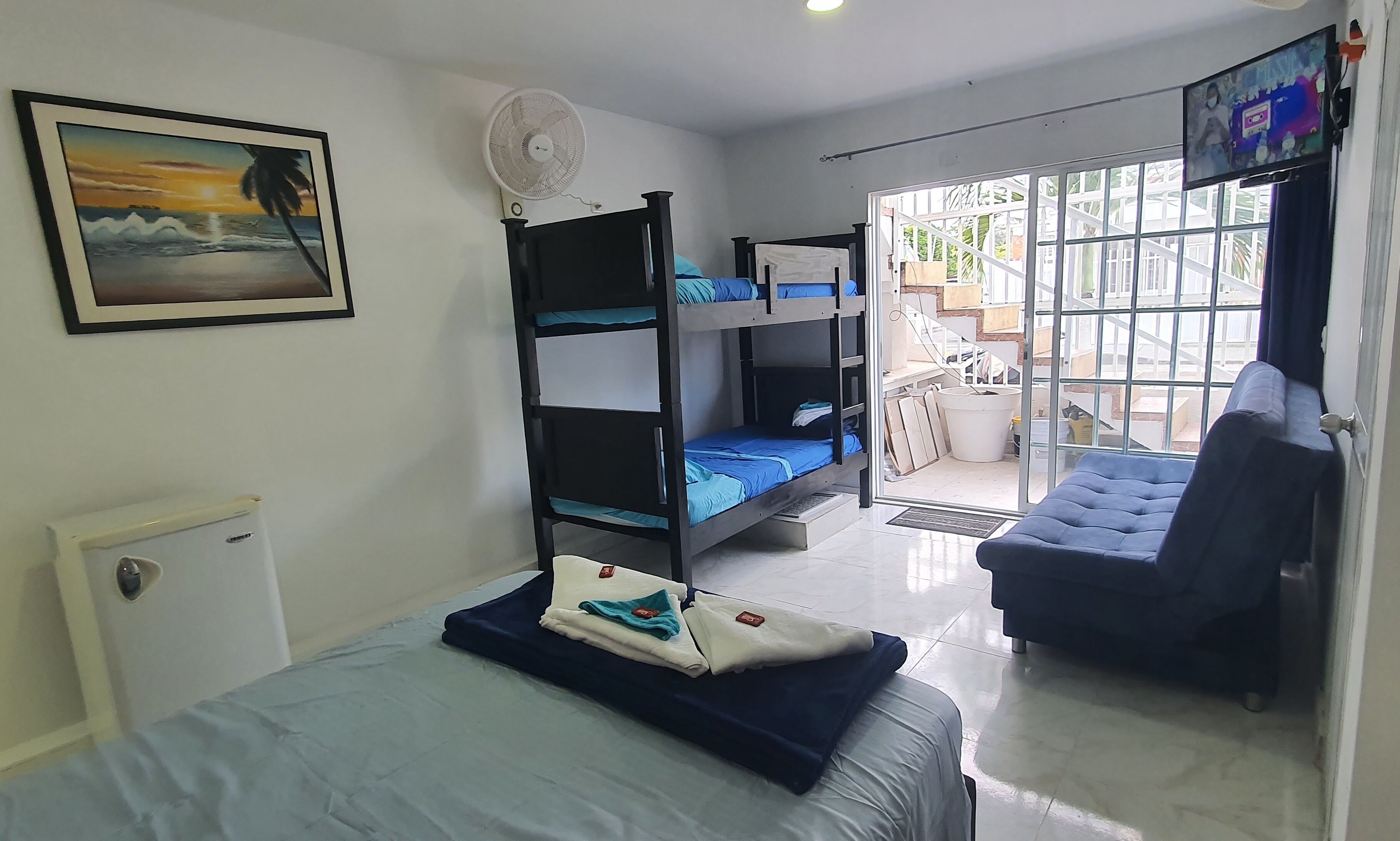 family room | 1 bedroom, minibar, in-room safe, blackout curtains