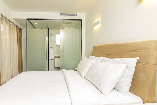 Ropa de cama de alta calidad y minibar