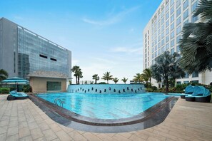 Outdoor pool, open 6:00 AM to 10:00 PM, pool loungers