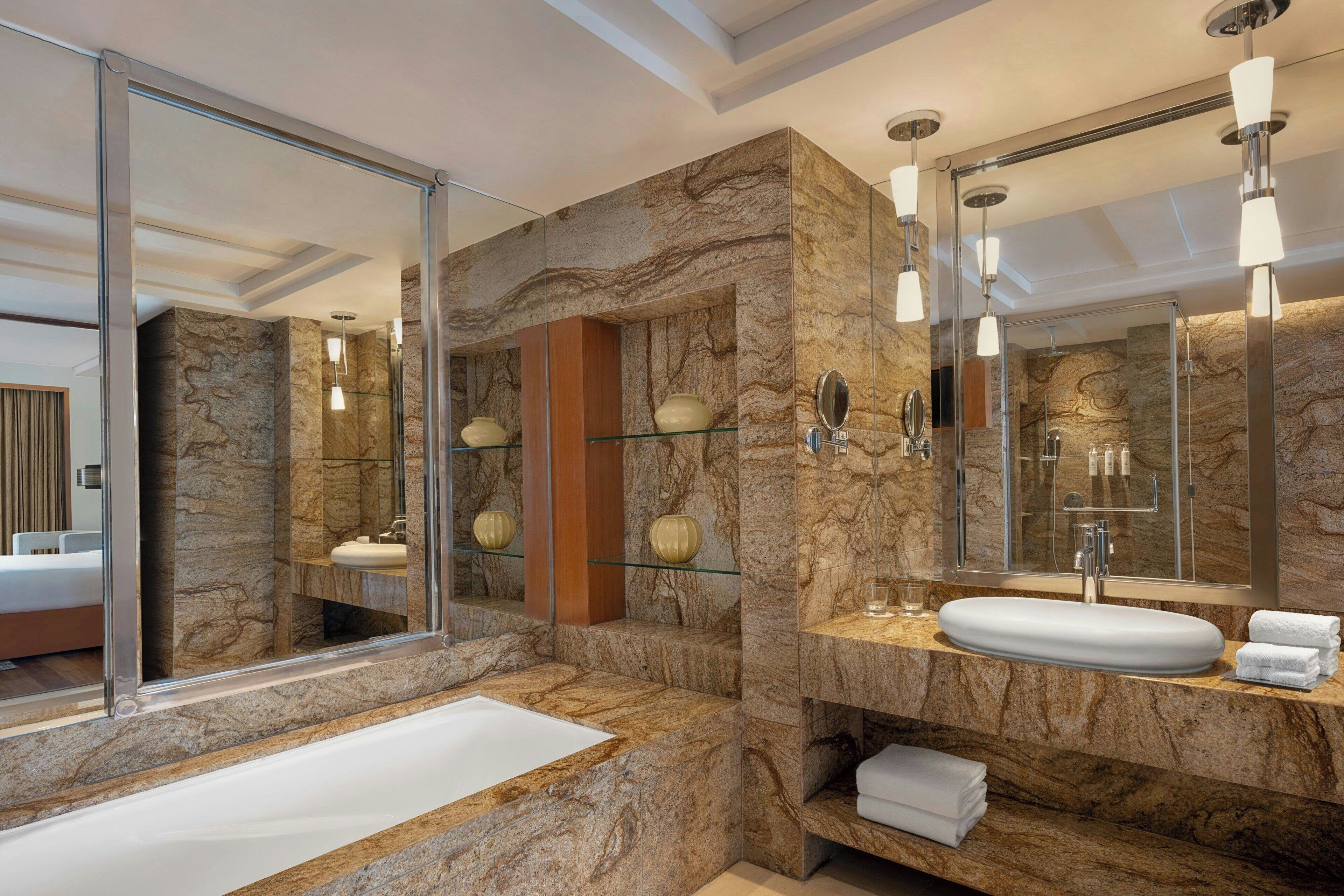 suite, 1 king bed | bathroom | separate bathtub and shower, deep-soaking bathtub, rainfall showerhead
