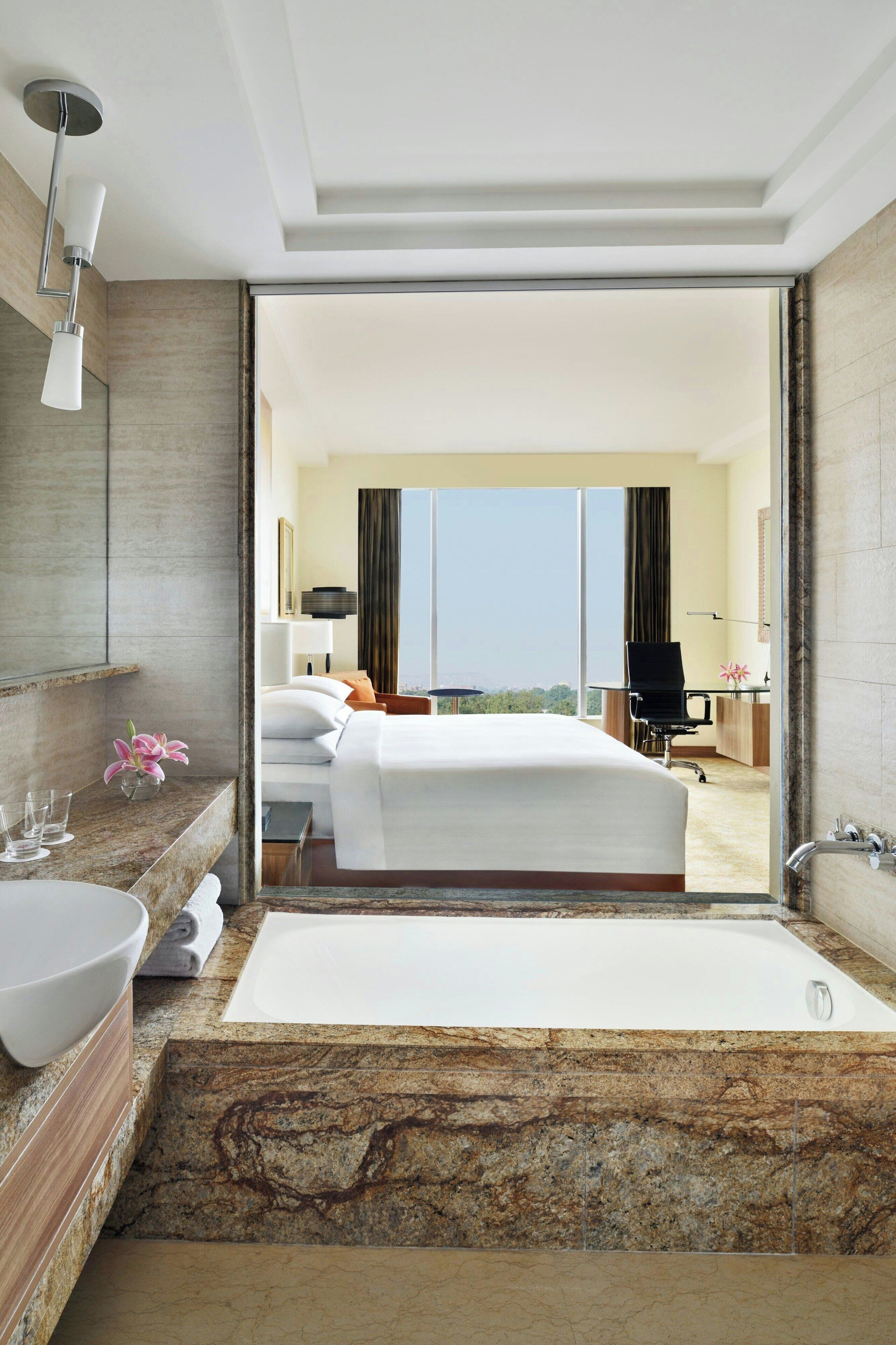 separate bathtub and shower, deep-soaking bathtub, rainfall showerhead