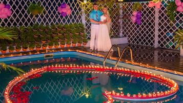 Outdoor pool, a rooftop pool, pool umbrellas, pool loungers