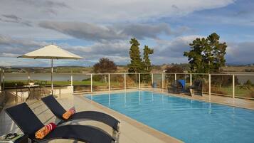 Outdoor pool, open 6:00 AM to 10:30 PM, pool umbrellas, pool loungers