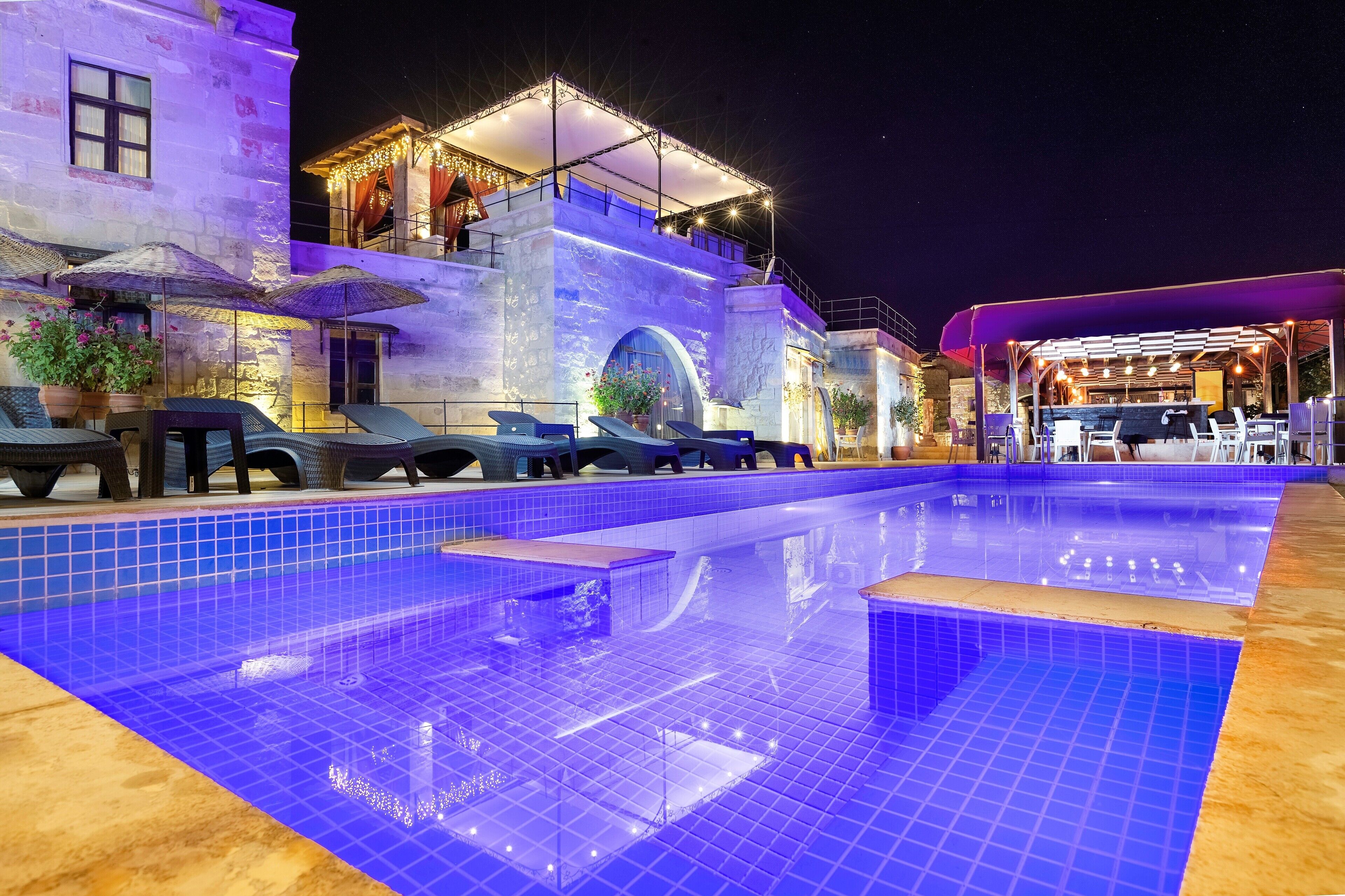 Seasonal outdoor pool, open 10:30 AM to 7 PM, pool umbrellas