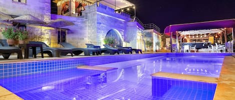 Seasonal outdoor pool, open 10:30 AM to 7 PM, pool umbrellas