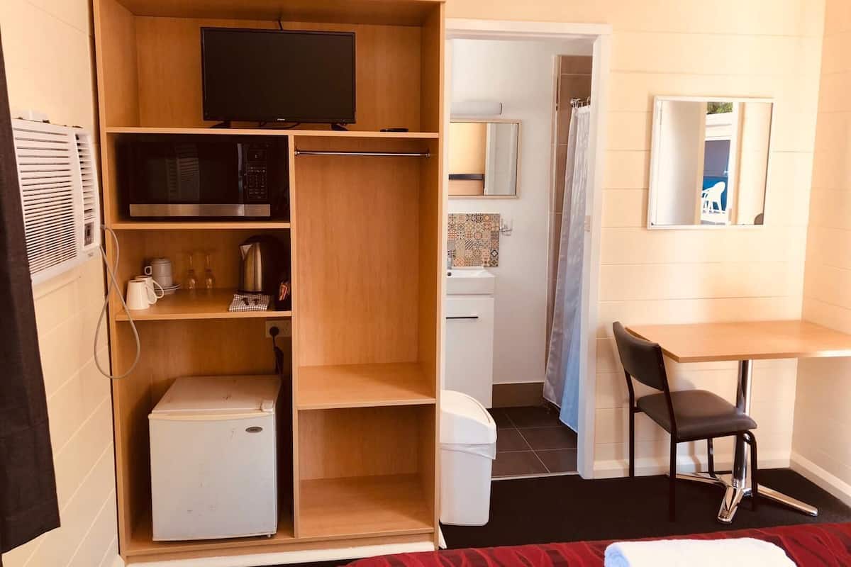 Minibar, desk, laptop workspace, iron/ironing board