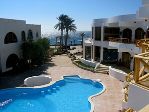 Indoor pool, outdoor pool, open 8 AM to 10 PM, free cabanas