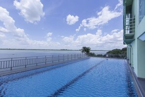 Deluxe Double Room, River View | Minibar, in-room safe, individually decorated, individually furnished