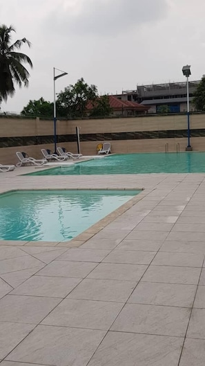 Seasonal outdoor pool, pool umbrellas