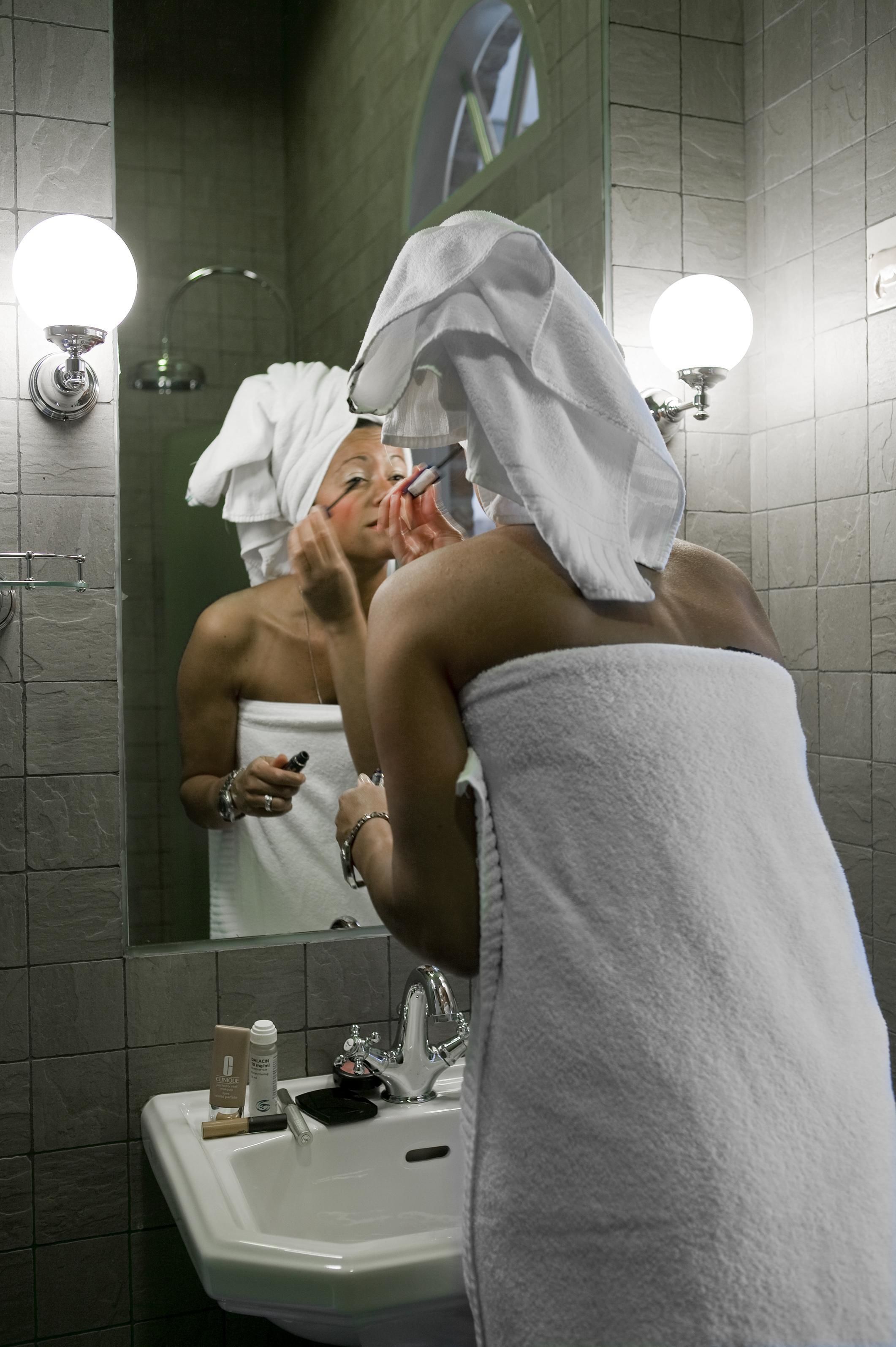 shower, rainfall showerhead, hair dryer, towels