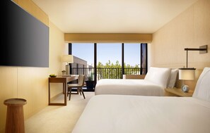 A hotel room with two beds, a desk, a chair, a small table, a potted plant, and a view of the outdoors. - Nobu Hotel Palo Alto (Palo Alto)