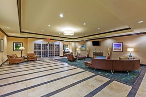 Relax in our spacious lobby with comfortable seating and a warm atmosphere.