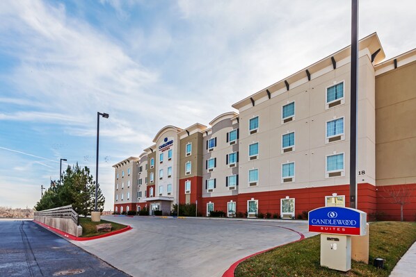 Experience the sleek, modern design of this hotel, featuring a symmetrical facade and covered entrance.